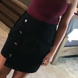 Asymmetrical black jean skirt